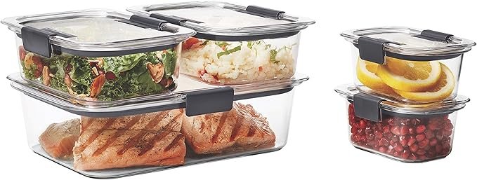 stackable food storage container set organized in small kitchen cabinet