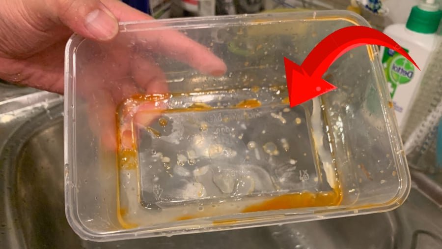 oil residue around food container lid no leak close up